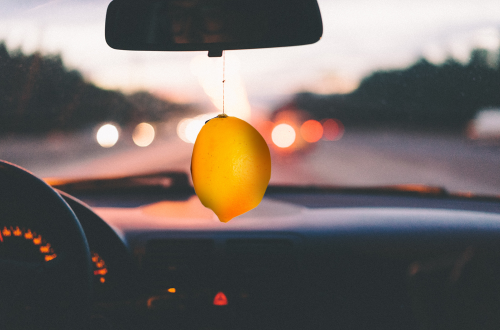 Car with a lemon used as an air freshener